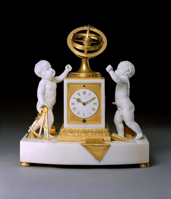 A REGENCY WHITE MARBLE PORCELAIN AND ORMOLU CLOCK